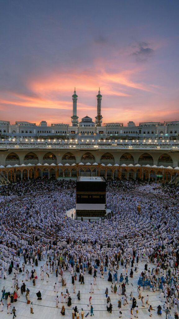 pexels-photo-18274181-18274181 Aerial view of the Kaaba surrounded by worshippers during dusk at the Grand Mosque in Mecca, Saudi Arabia.